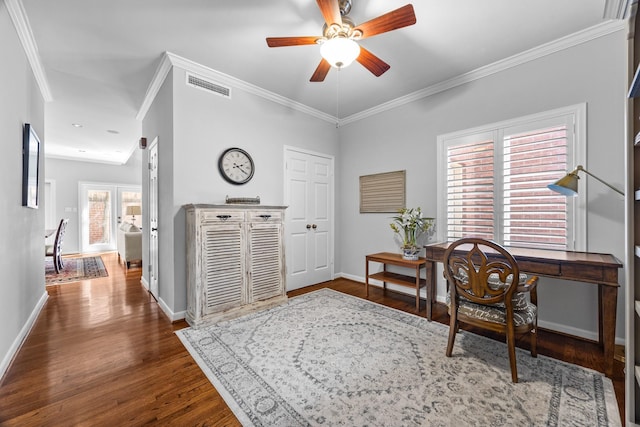 office featuring wood finished floors, visible vents, ornamental molding, and baseboards