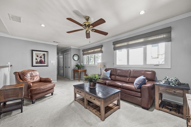 living room featuring recessed lighting, ornamental molding, light carpet, visible vents, and a ceiling fan