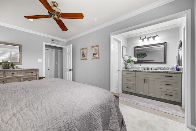 bedroom featuring ceiling fan, ensuite bath, carpet floors, and crown molding