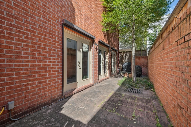 view of patio with fence and french doors