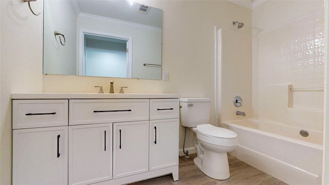 bathroom featuring ornamental molding, toilet, bathtub / shower combination, vanity, and wood finished floors
