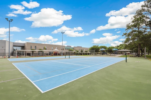 view of sport court with community basketball court and fence