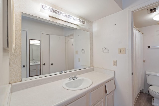 7931 Ellinger Ln, Houston, TX 77040 - full bathroom with toilet, wood finished floors, and vanity
