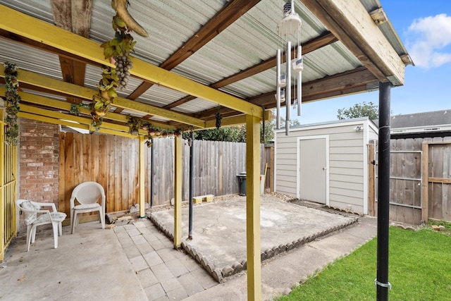 7931 Ellinger Ln, Houston, TX 77040 - view of patio featuring a fenced backyard, an outdoor structure, and a storage unit