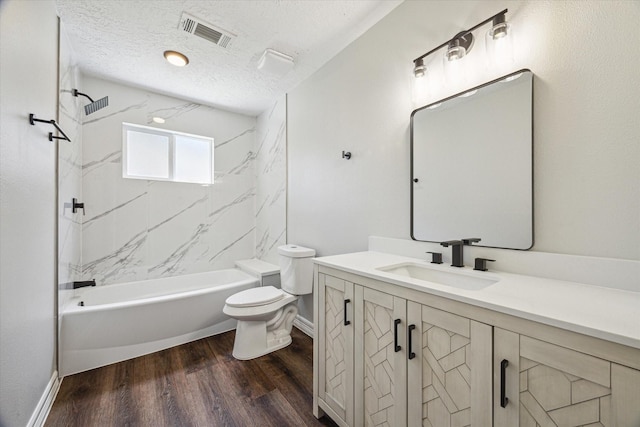 full bathroom featuring a textured ceiling, vanity, visible vents, toilet, and baseboards
