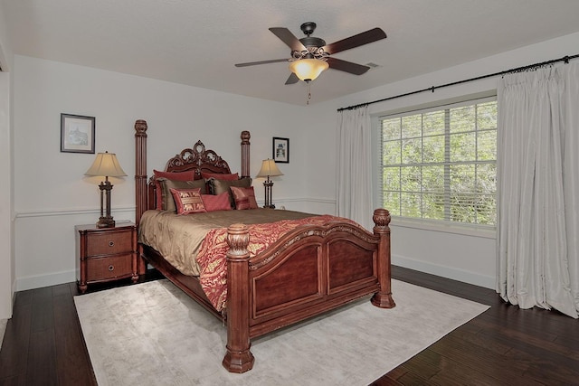 38 Southgate Dr, The Woodlands, TX 77380 - bedroom with visible vents, baseboards, ceiling fan, and wood finished floors