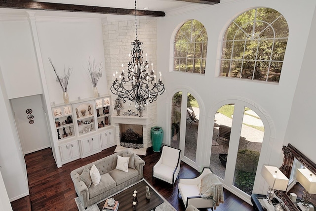 38 Southgate Dr, The Woodlands, TX 77380 - living area featuring a towering ceiling, dark wood-style flooring, an inviting chandelier, and ornamental molding