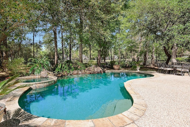 38 Southgate Dr, The Woodlands, TX 77380 - view of swimming pool with a patio area and a pool with connected hot tub