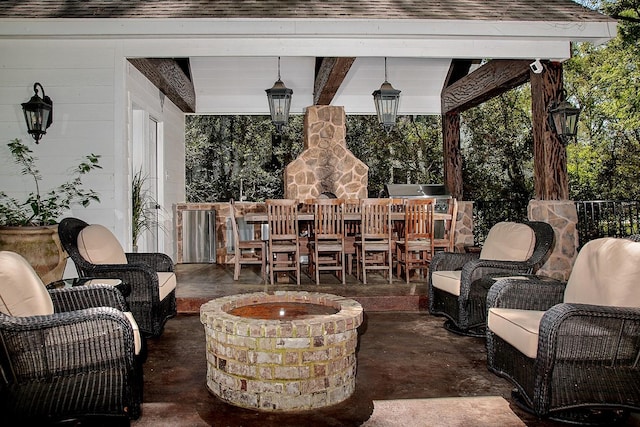 38 Southgate Dr, The Woodlands, TX 77380 - view of patio / terrace featuring an outdoor living space with a fire pit