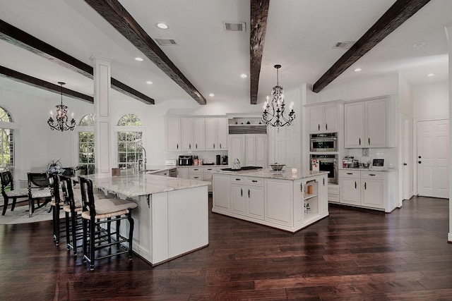 38 Southgate Dr, The Woodlands, TX 77380 - kitchen with a chandelier, a wealth of natural light, visible vents, and stainless steel appliances