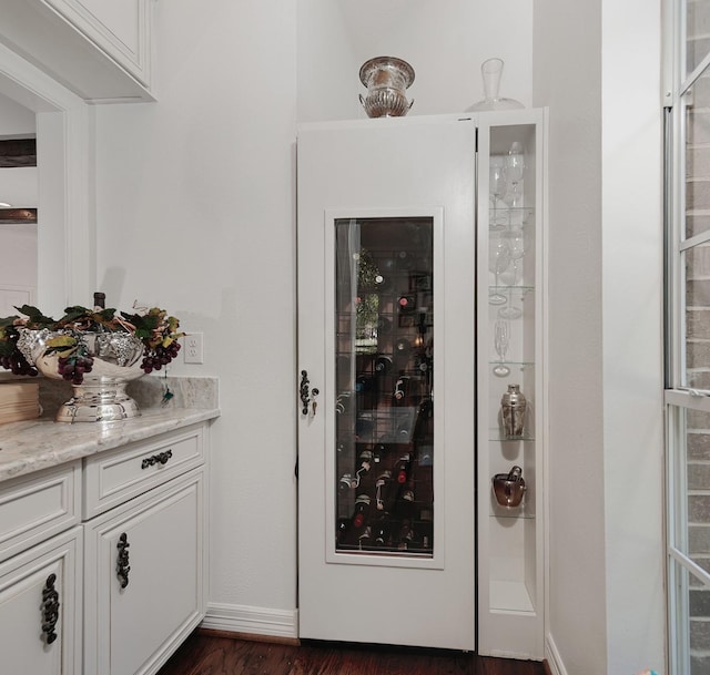 38 Southgate Dr, The Woodlands, TX 77380 - wine area featuring dark wood-type flooring and baseboards