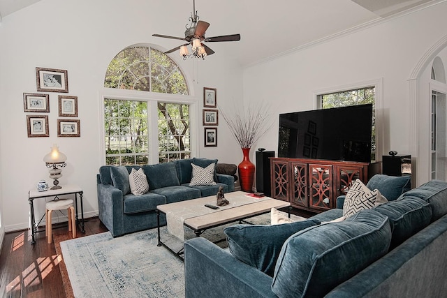 38 Southgate Dr, The Woodlands, TX 77380 - living area with arched walkways, plenty of natural light, dark wood finished floors, and ceiling fan