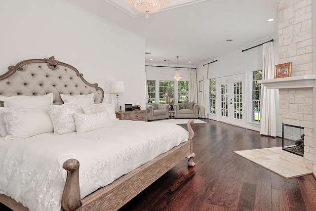 38 Southgate Dr, The Woodlands, TX 77380 - bedroom with a large fireplace, recessed lighting, crown molding, access to exterior, and wood finished floors