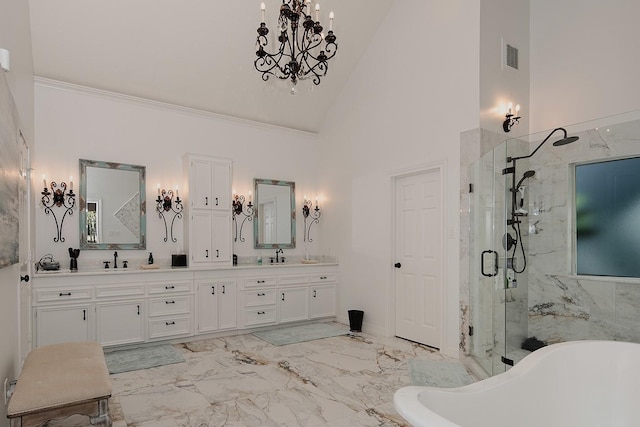 38 Southgate Dr, The Woodlands, TX 77380 - full bath with a freestanding bath, a sink, double vanity, a marble finish shower, and marble finish floor