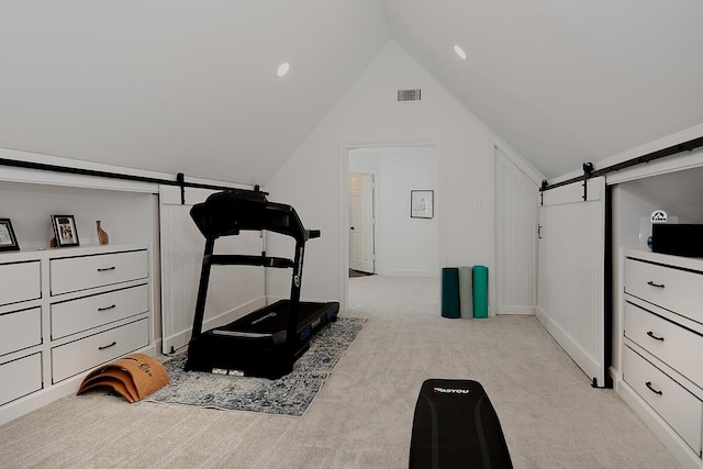 38 Southgate Dr, The Woodlands, TX 77380 - exercise area featuring carpet, vaulted ceiling, visible vents, a barn door, and baseboards