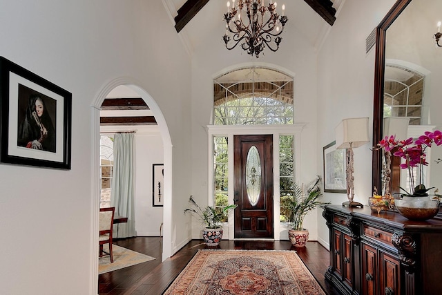 38 Southgate Dr, The Woodlands, TX 77380 - entrance foyer featuring arched walkways, high vaulted ceiling, hardwood / wood-style floors, and an inviting chandelier