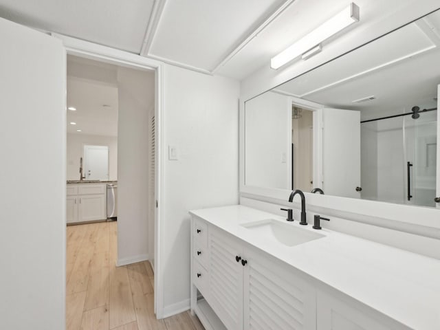 1812 Saxony Ln, Houston, TX 77058 - full bathroom with vanity, wood finished floors, and baseboards