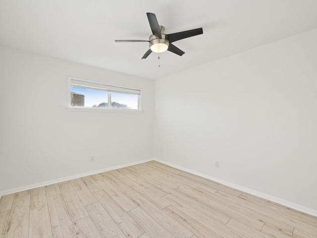 1812 Saxony Ln, Houston, TX 77058 - empty room with light wood finished floors, a ceiling fan, and baseboards