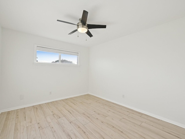 1812 Saxony Ln, Houston, TX 77058 - empty room featuring light wood-style flooring, a ceiling fan, and baseboards