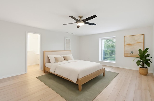 1812 Saxony Ln, Houston, TX 77058 - bedroom with light wood-style floors, baseboards, and ceiling fan