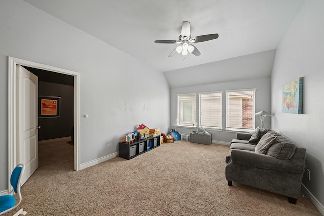 sitting room featuring baseboards, a ceiling fan, lofted ceiling, and carpet flooring