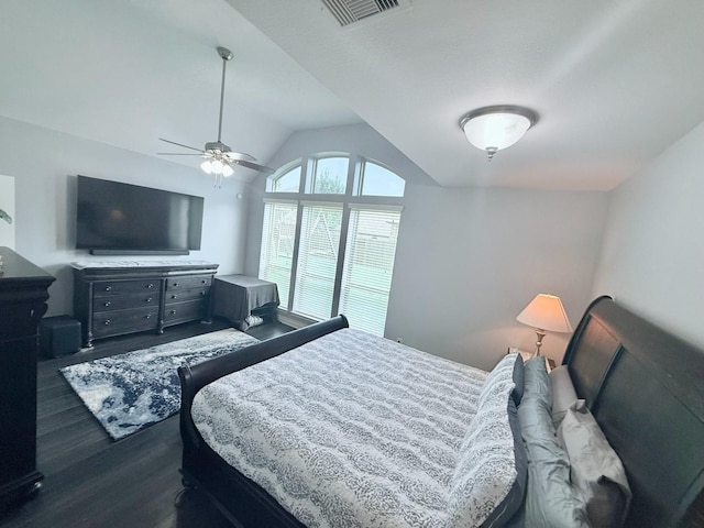 bedroom featuring visible vents, a ceiling fan, dark wood-style flooring, and lofted ceiling