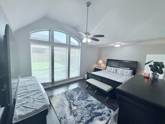 bedroom with wood finished floors, ceiling fan, and vaulted ceiling