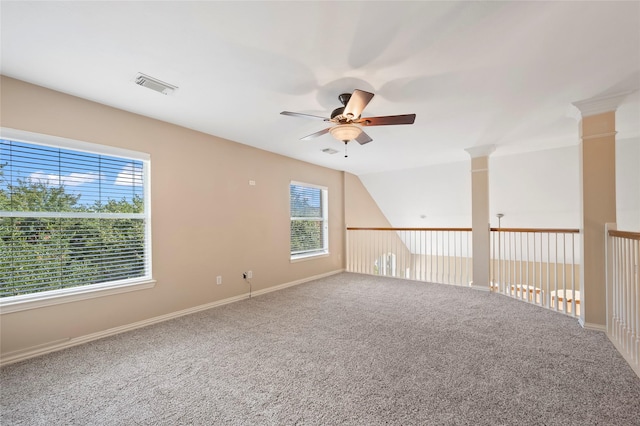 10130 Lakeside Gables Dr, Houston, TX 77065 - empty room with visible vents, baseboards, ceiling fan, carpet floors, and ornate columns