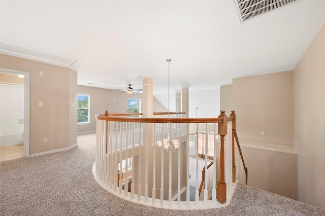 10130 Lakeside Gables Dr, Houston, TX 77065 - hallway featuring baseboards, carpet flooring, an upstairs landing, visible vents, and ornate columns