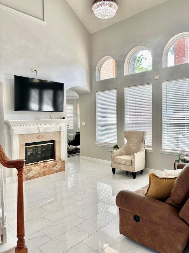 11423 Corola Trail Dr, Houston, TX 77066 - living room featuring arched walkways, a healthy amount of sunlight, marble finish floor, and high vaulted ceiling
