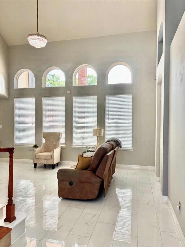 11423 Corola Trail Dr, Houston, TX 77066 - living room with marble finish floor, baseboards, and a towering ceiling