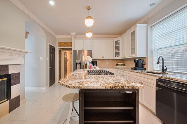 11423 Corola Trail Dr, Houston, TX 77066 - kitchen with stainless steel appliances, light marble finish flooring, light stone counters, white cabinets, and hanging light fixtures