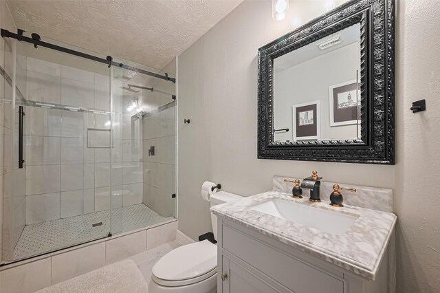 11423 Corola Trail Dr, Houston, TX 77066 - bathroom featuring vanity, a stall shower, and a textured ceiling