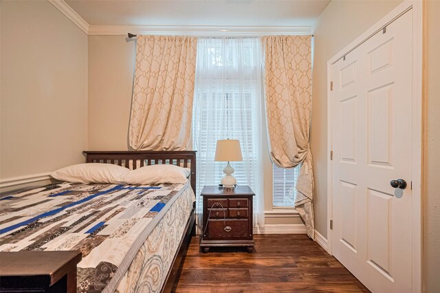 11423 Corola Trail Dr, Houston, TX 77066 - bedroom with dark wood-style flooring, multiple windows, and crown molding
