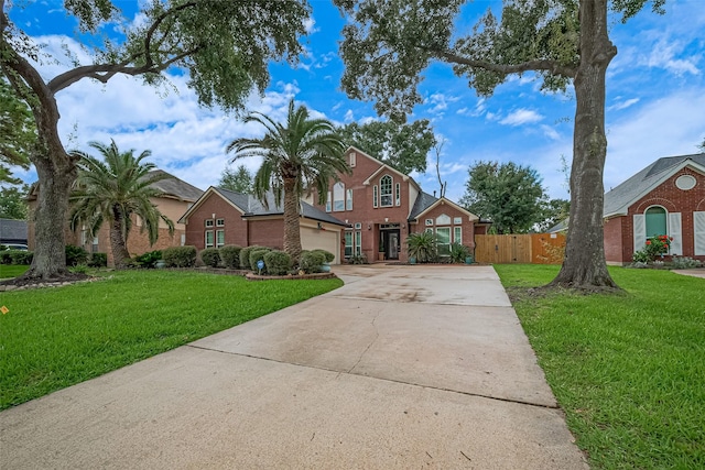 11423 Corola Trail Dr, Houston, TX 77066 - traditional-style home featuring driveway, an attached garage, and brick siding