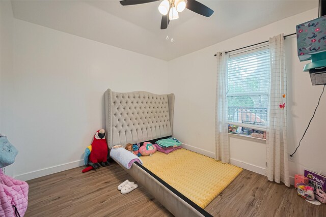11423 Corola Trail Dr, Houston, TX 77066 - bedroom featuring wood finished floors and a ceiling fan
