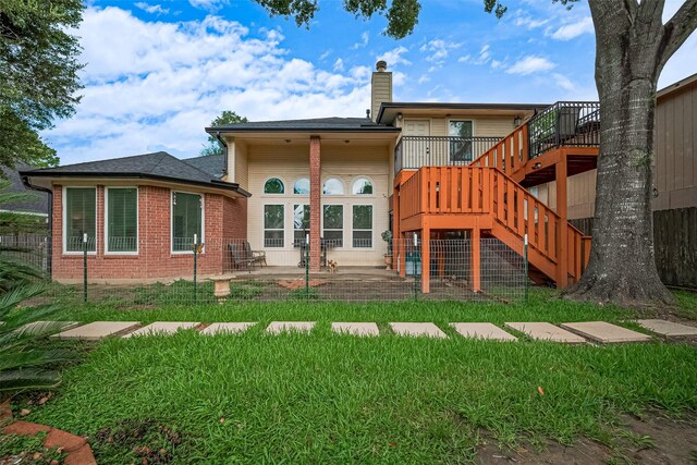 11423 Corola Trail Dr, Houston, TX 77066 - rear view of house featuring a patio, stairs, a chimney, a lawn, and a wooden deck