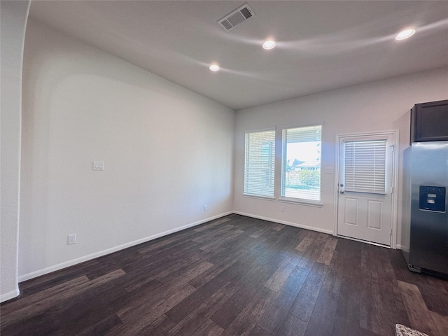 24410 Bludana Ln, Richmond, TX 77406 - unfurnished room featuring dark wood-style flooring, visible vents, baseboards, and recessed lighting