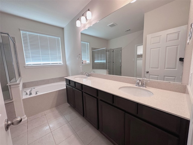 24410 Bludana Ln, Richmond, TX 77406 - bathroom with a bath, visible vents, a sink, and a stall shower