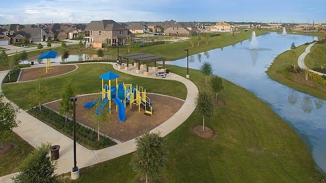 24410 Bludana Ln, Richmond, TX 77406 - view of home's community featuring a lawn, playground community, a residential view, and a water view