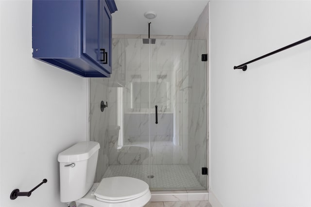 bathroom with a marble finish shower and toilet