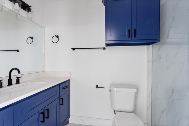 bathroom with toilet and vanity