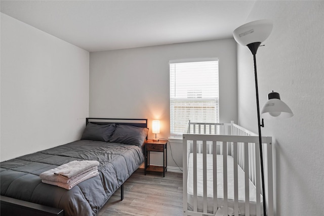 bedroom with wood finished floors