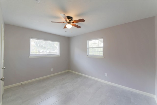 3605 Barberry Dr, Houston, TX 77051 - empty room featuring baseboards, a ceiling fan, and light tile patterned flooring