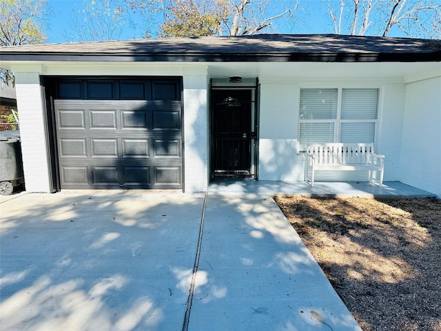 3605 Barberry Dr, Houston, TX 77051 - view of front of home featuring a garage, concrete driveway, covered porch, and brick siding