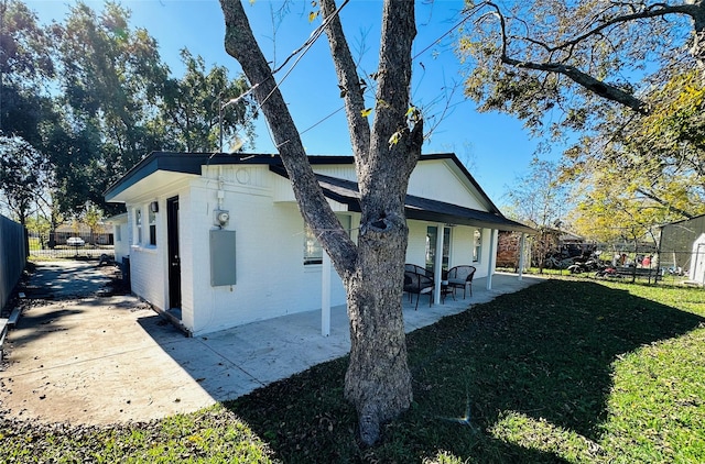 3605 Barberry Dr, Houston, TX 77051 - exterior space with a patio area, brick siding, fence, and a lawn