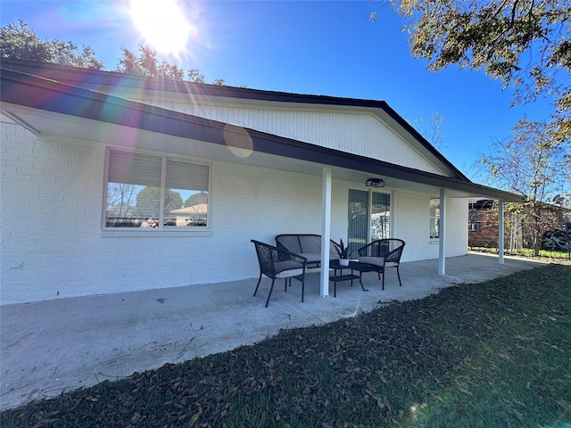 3605 Barberry Dr, Houston, TX 77051 - back of property featuring brick siding, an outdoor living space, and a patio