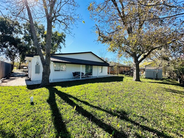 3605 Barberry Dr, Houston, TX 77051 - back of house with a yard, a patio area, and fence