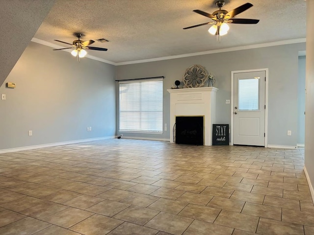 unfurnished living room with visible vents, baseboards, a ceiling fan, and a textured ceiling