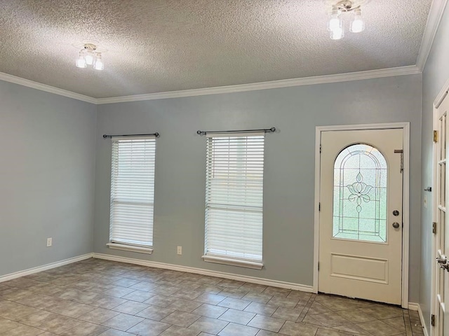 tiled foyer entrance featuring a textured ceiling, a healthy amount of sunlight, and ornamental molding